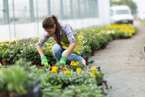 Front view of a gardener preparing tools before work