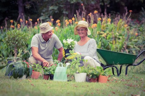 Gardener Hounslow team collecting green waste in a residential garden